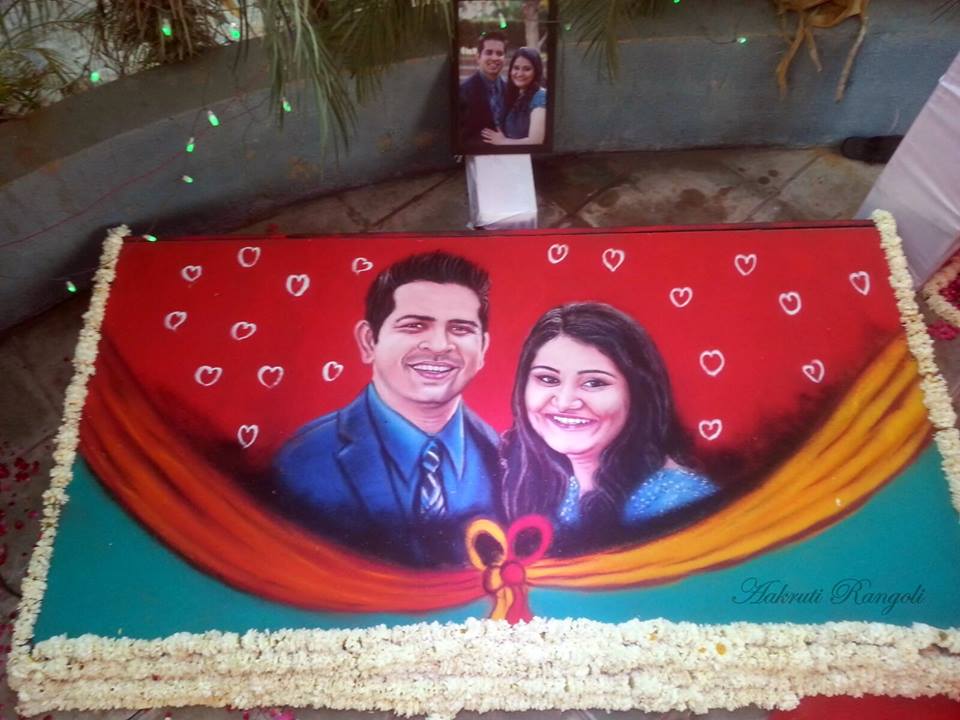 Wedding portrait rangoli design by aakruti